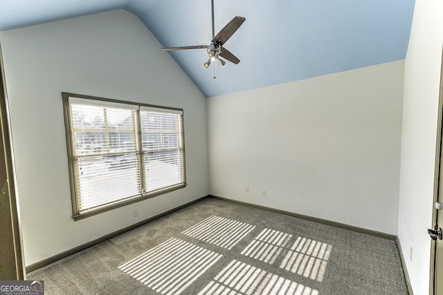 spare room with high vaulted ceiling, carpet, ceiling fan, and baseboards