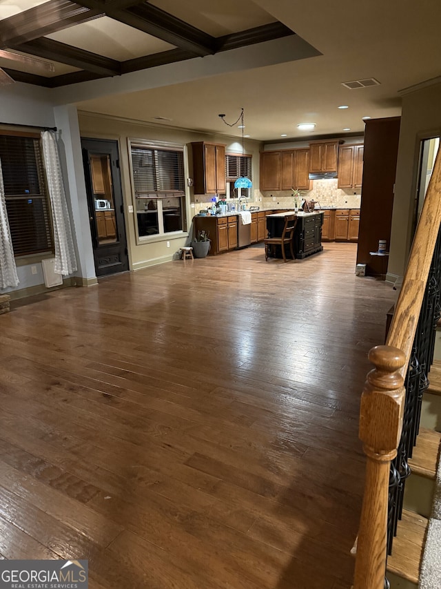 interior space with dark wood-type flooring and coffered ceiling