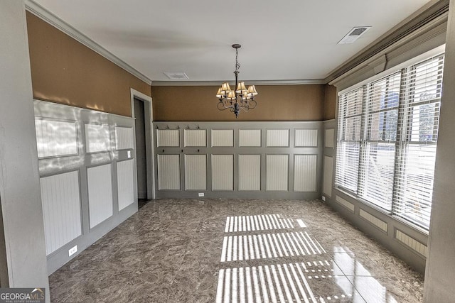 unfurnished dining area with ornamental molding, visible vents, and a notable chandelier