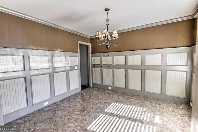 unfurnished dining area with ornamental molding and a notable chandelier