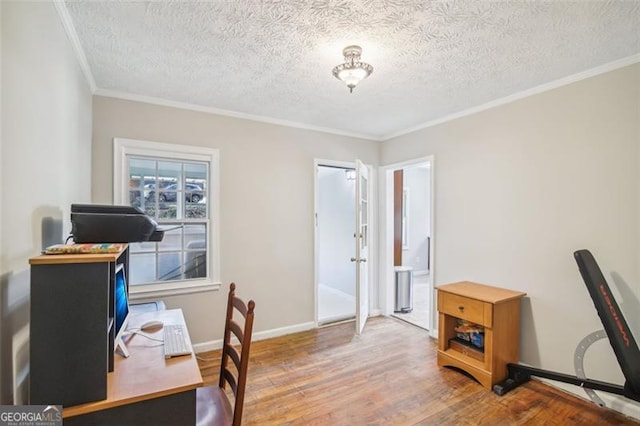 office with a textured ceiling, ornamental molding, and hardwood / wood-style floors