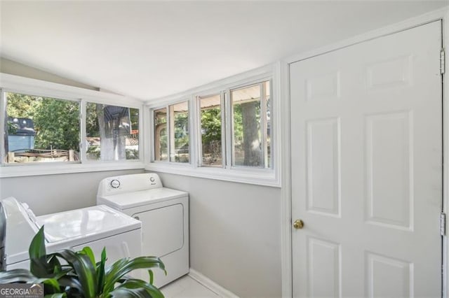 clothes washing area featuring independent washer and dryer