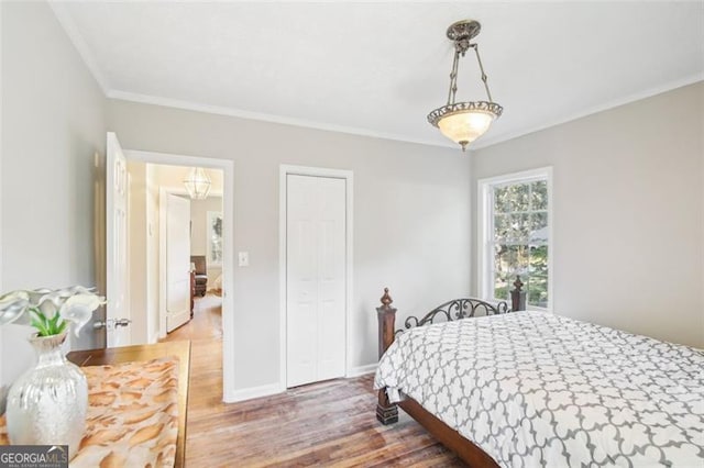 bedroom featuring wood-type flooring and ornamental molding