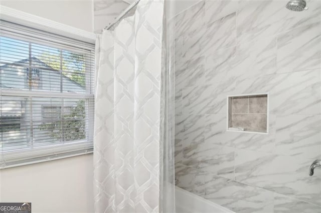 bathroom featuring shower / bath combination with curtain