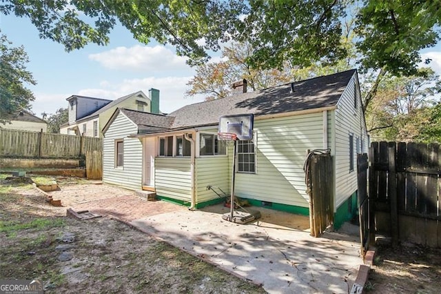 back of house with a patio