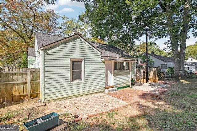 back of property featuring a patio area