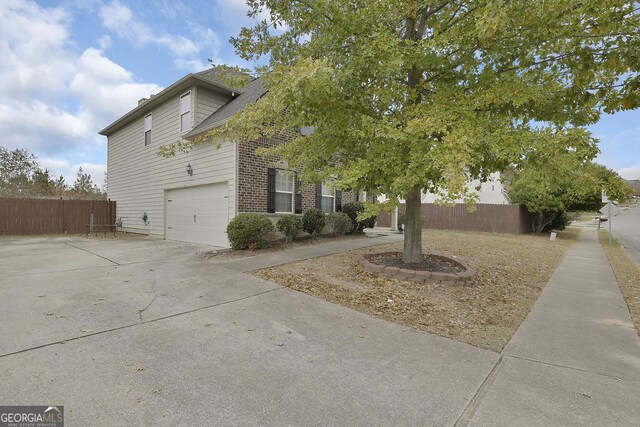 view of side of home featuring a garage