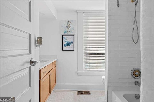 full bathroom with vanity, shower / bath combo, toilet, and tile patterned flooring