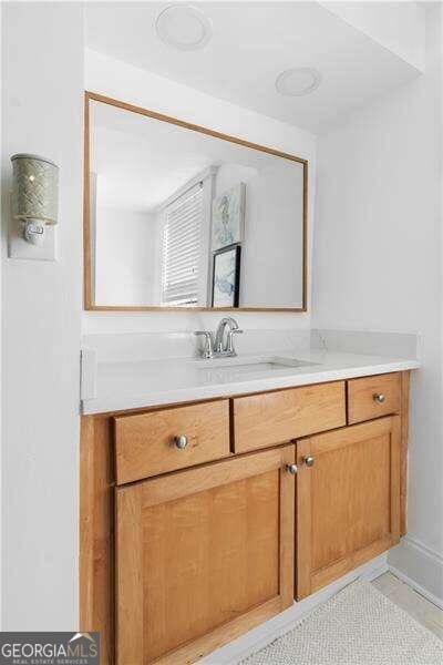 bathroom with vanity and tile patterned floors