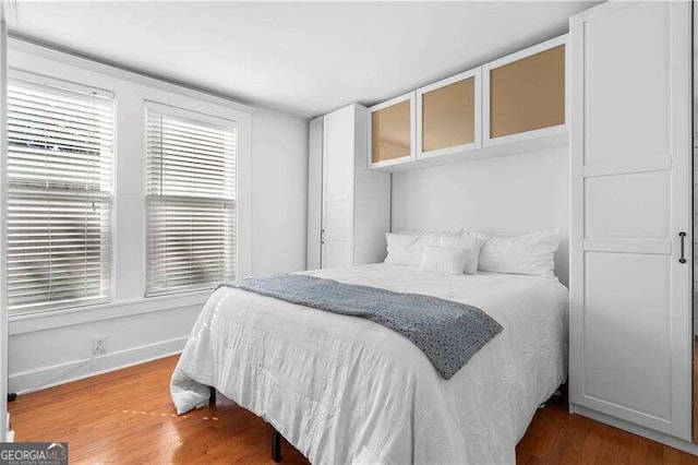 bedroom featuring hardwood / wood-style flooring