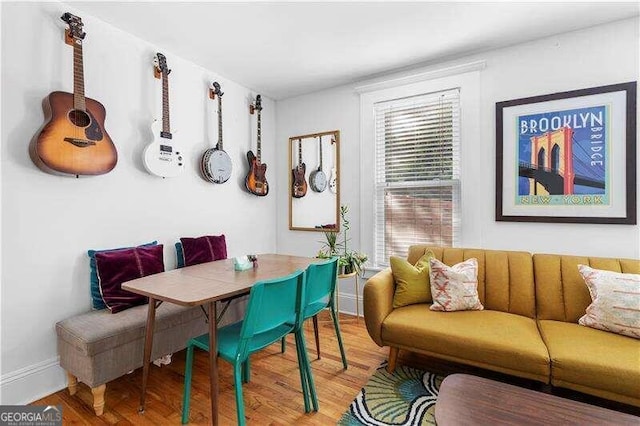 dining room with breakfast area and hardwood / wood-style floors