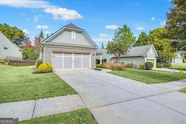 view of front of home with a garage, driveway, brick siding, and a front lawn