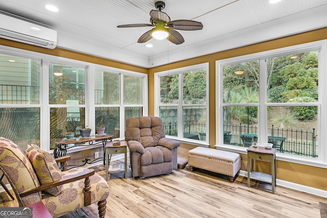 sunroom / solarium featuring a ceiling fan and a wall mounted AC