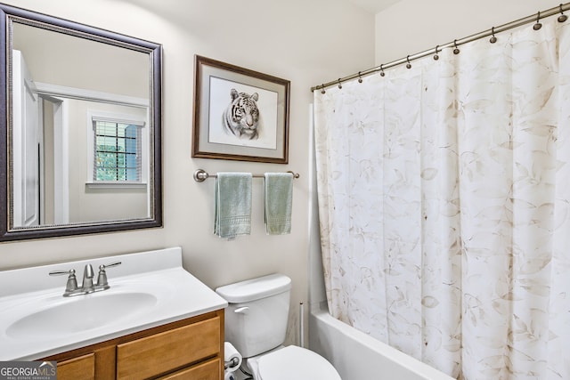 bathroom featuring toilet, shower / bath combo, and vanity