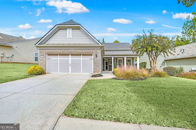 view of front of house with a garage, covered porch, brick siding, concrete driveway, and a front yard