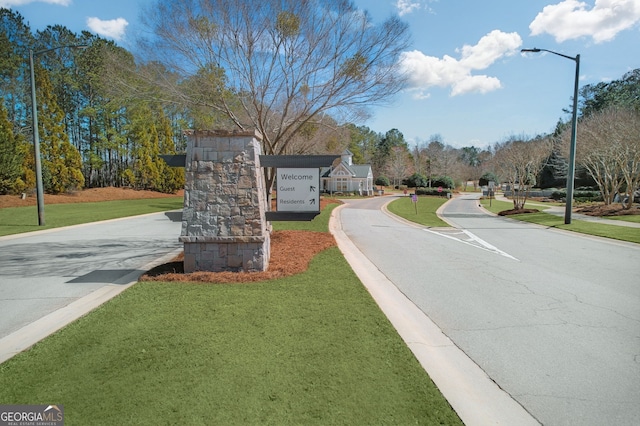 view of street with curbs and street lights