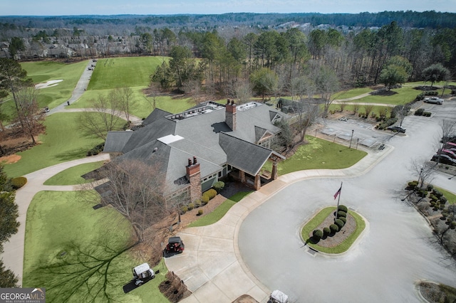 birds eye view of property with a forest view