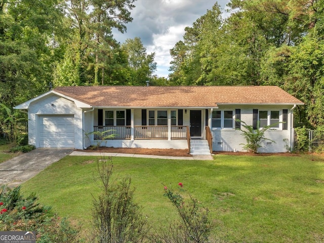 ranch-style house featuring a front yard, a porch, and a garage