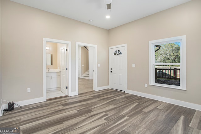 foyer featuring hardwood / wood-style floors and ceiling fan