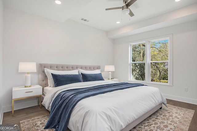 bedroom featuring dark hardwood / wood-style flooring and ceiling fan