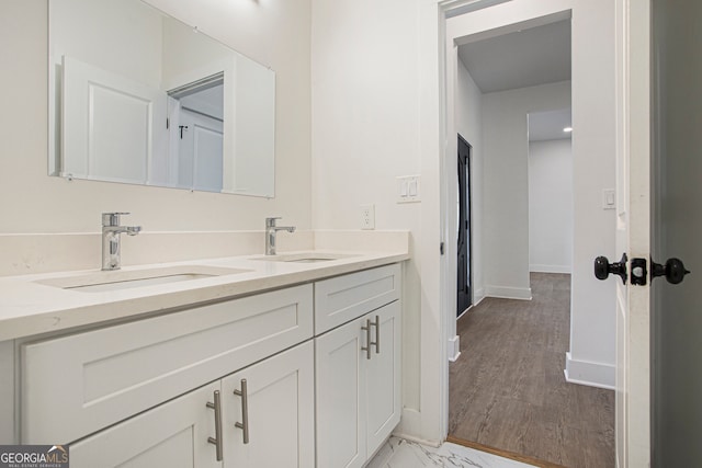 bathroom featuring wood-type flooring and vanity