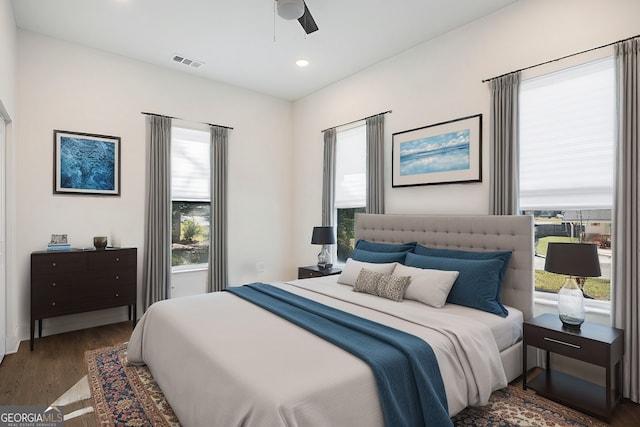 bedroom with dark wood-type flooring and ceiling fan