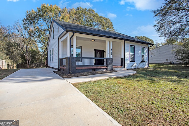 view of front of home with a porch and a front lawn