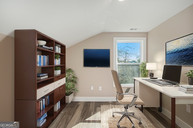 office area featuring dark wood-type flooring and vaulted ceiling