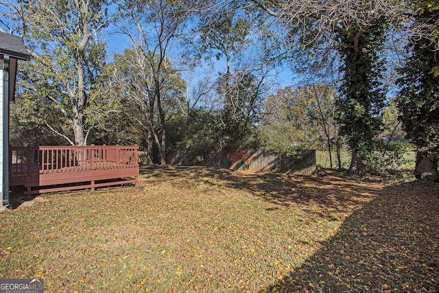 view of yard featuring a wooden deck