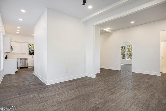 unfurnished room with dark hardwood / wood-style flooring