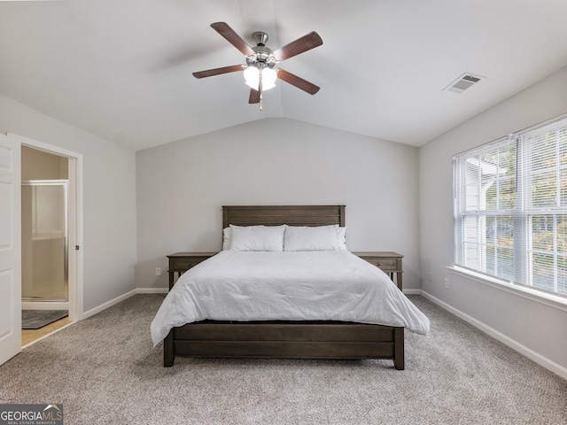 bedroom with ceiling fan, light carpet, and vaulted ceiling