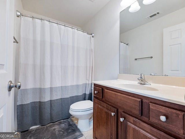 bathroom with vanity, a shower with shower curtain, toilet, and tile patterned flooring