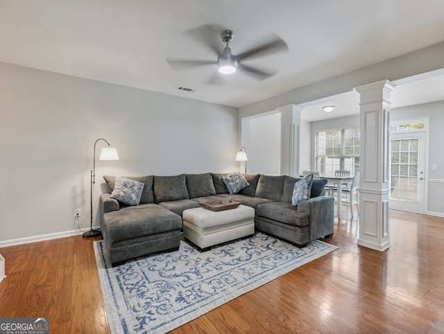 living room featuring hardwood / wood-style flooring and ceiling fan