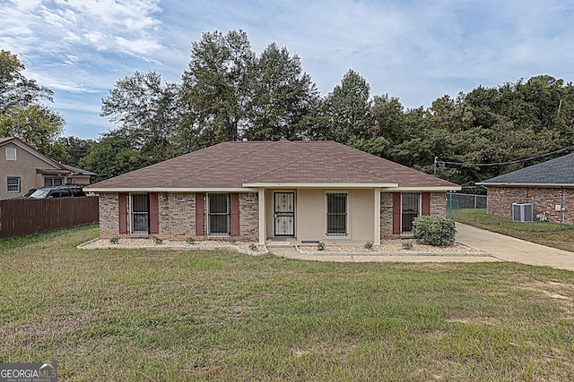 single story home with a front lawn