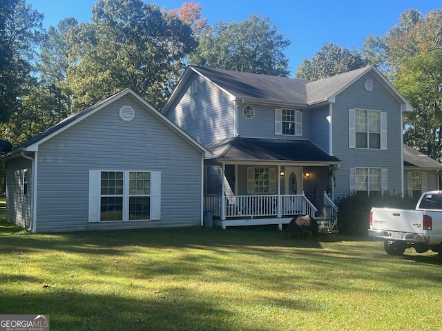 view of front facade with a front lawn and covered porch