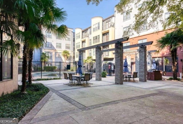 surrounding community with a patio area