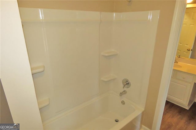 bathroom with vanity, bathtub / shower combination, and wood-type flooring