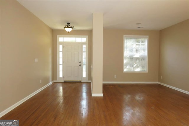 entrance foyer featuring dark hardwood / wood-style flooring