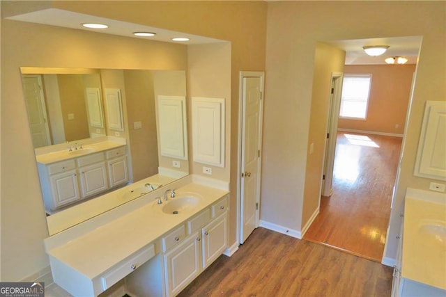 bathroom with vanity and hardwood / wood-style flooring