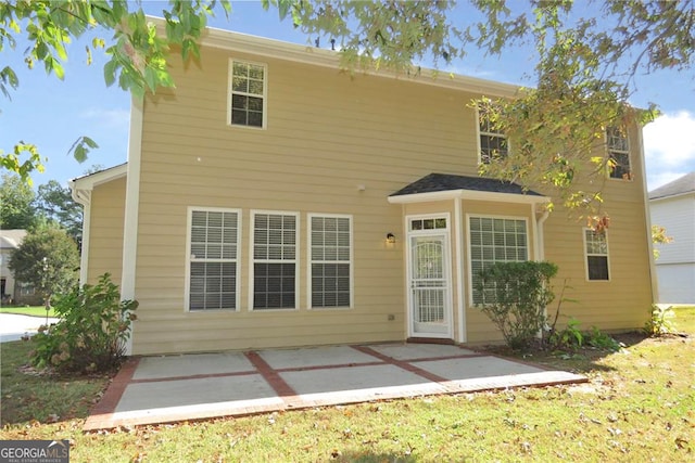 back of property featuring a patio