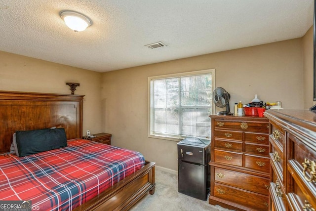 carpeted bedroom with a textured ceiling