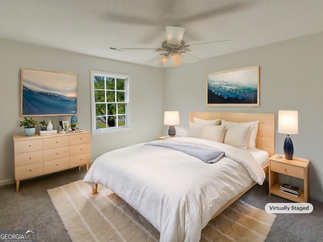 carpeted bedroom with ceiling fan