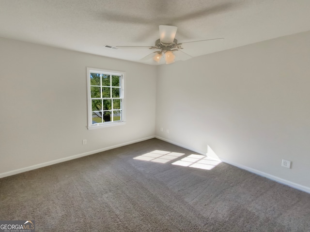 empty room with carpet floors and ceiling fan