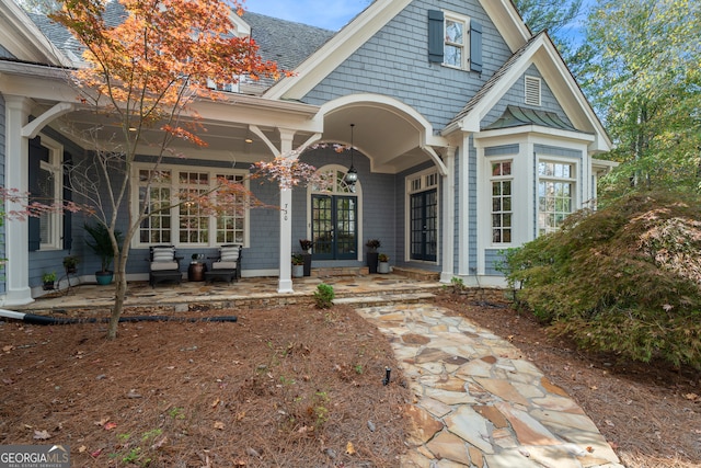 rear view of property with a patio and an outdoor hangout area