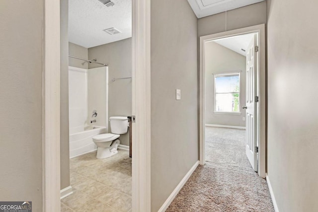 hallway featuring a textured ceiling