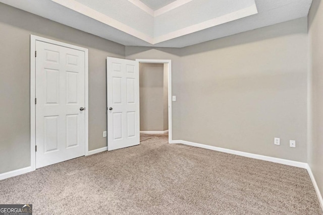 unfurnished bedroom featuring a textured ceiling and carpet floors