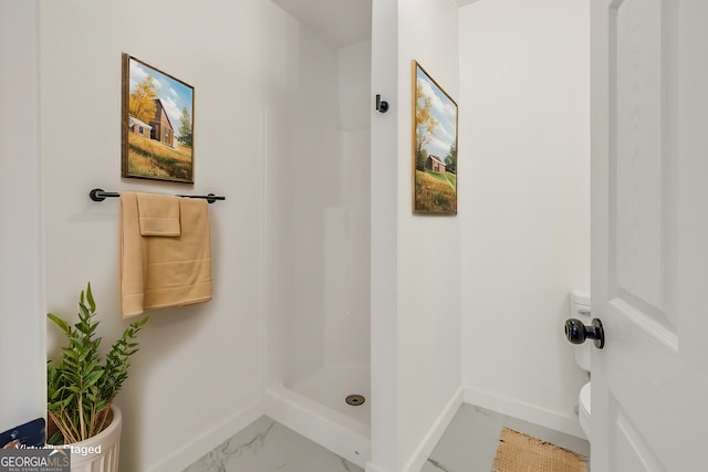 bathroom with toilet and walk in shower