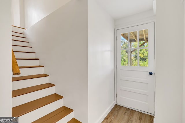 doorway with light wood-type flooring