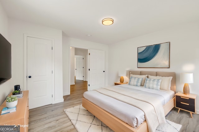 bedroom with light hardwood / wood-style floors