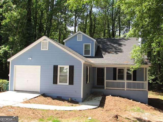 view of front of property with a porch and a garage